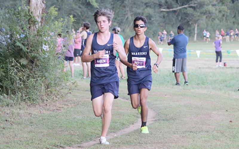 Aiden Pickett, left, and Alex Brannon make head toward the two-mile marker during the North Hall meet. (Photo/Mark Turner)