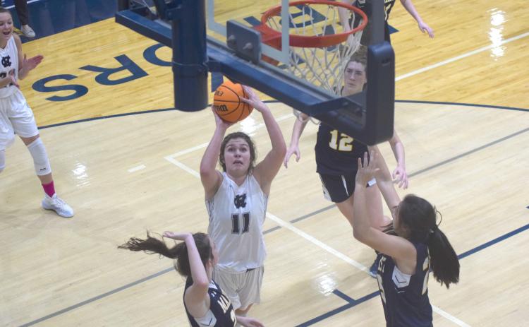Maddie Futch puts up a shot from close range during the first quarter of the Regon 7-AAAA matchup Tuesday night in Cleveland. (Photo/Mark Turner)