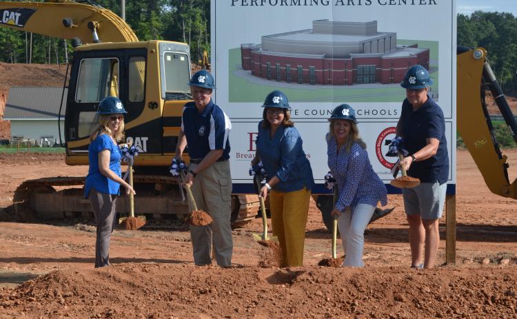 School board members broke ground Tuesday on a new 41,000 square-ft. performing arts center on the campus of White County High School. From left are Linda Erbele, vice-chairman Charlie Thomas, Superintendent Dr. Laurie Burkett, chairman Missy Jarrard and Jon Estes.