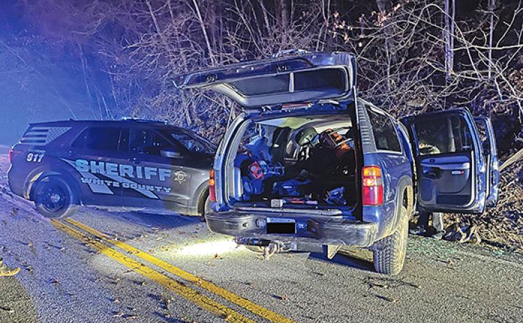 Deputies examine a wrecked vehicle that led a high-speed chase from White into Lumpkin, damaging patrol cars from both counties in the process. The driver was arrested in Lumpkin. (Photo/submitted)