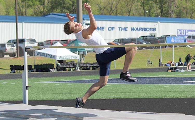 Carter Joe Pierce, above, and John Phillips both posted a height of 6-0 in the high jump at the sectional meet to qualify for the state meet. (Photo/Mark Turner)