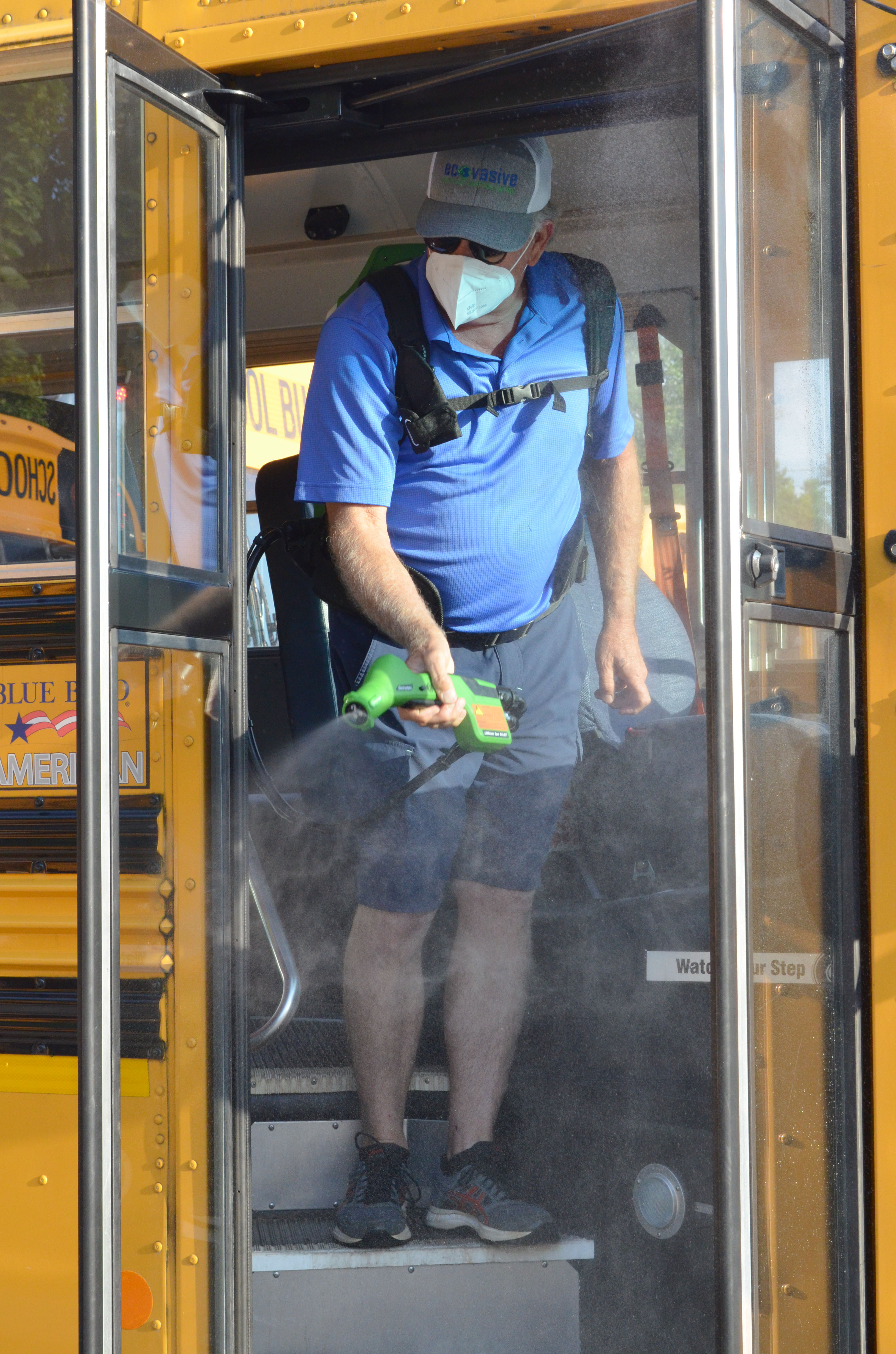Dan Peterson with Ecovasive spays down one of the White County School buses with a solution to protect againt coronavirus on Wednesday, July 15. The application lasts 90 days, and will be reapplied every 90 days for the entire school year, said Assistant Superintendent Scott justus. (Photo/Stephanie Hill)