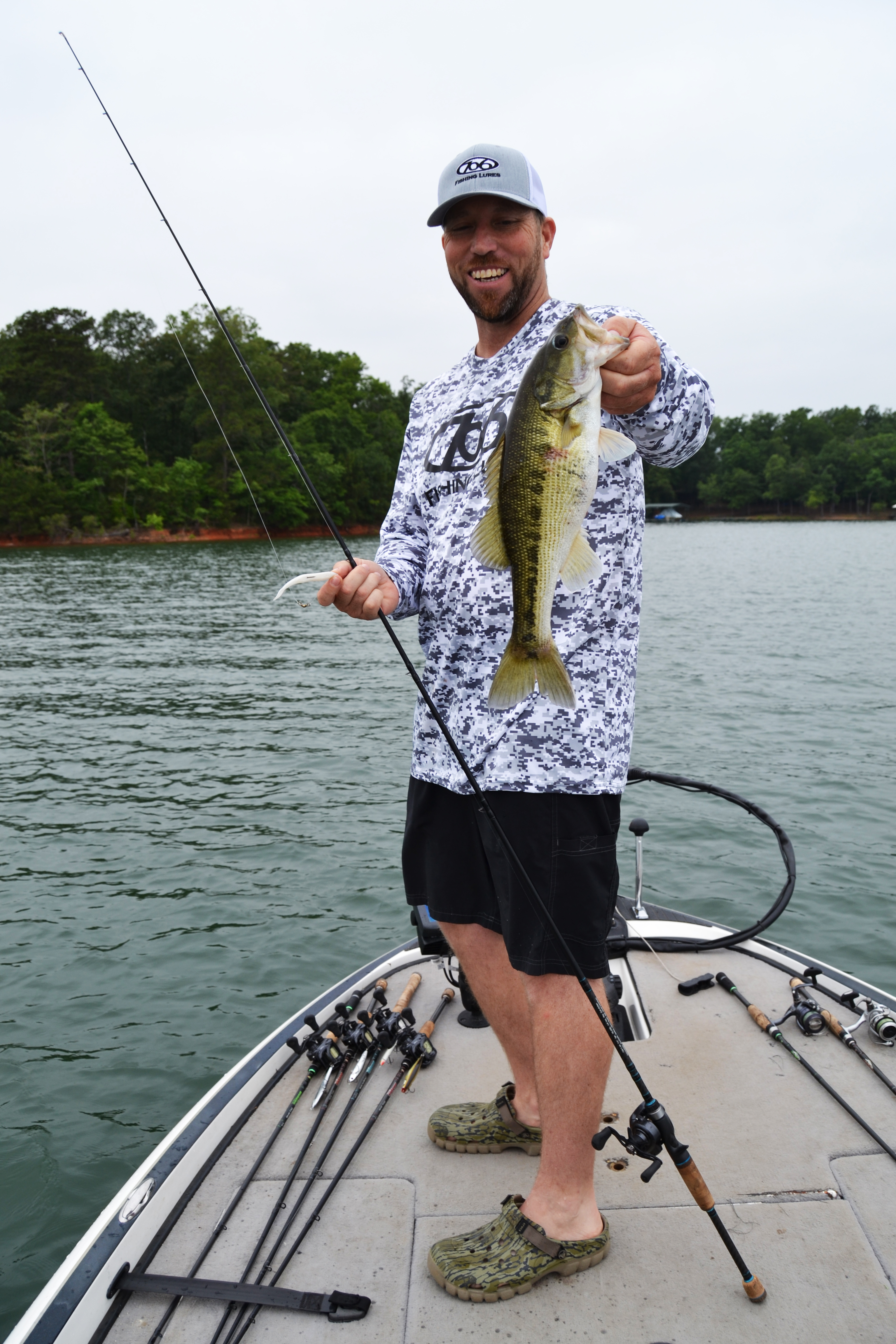 Fishing guide Josh Fowler shows a large-mouth fishing bass caught on Lake Hartwell. (Photo/Michael Isom)