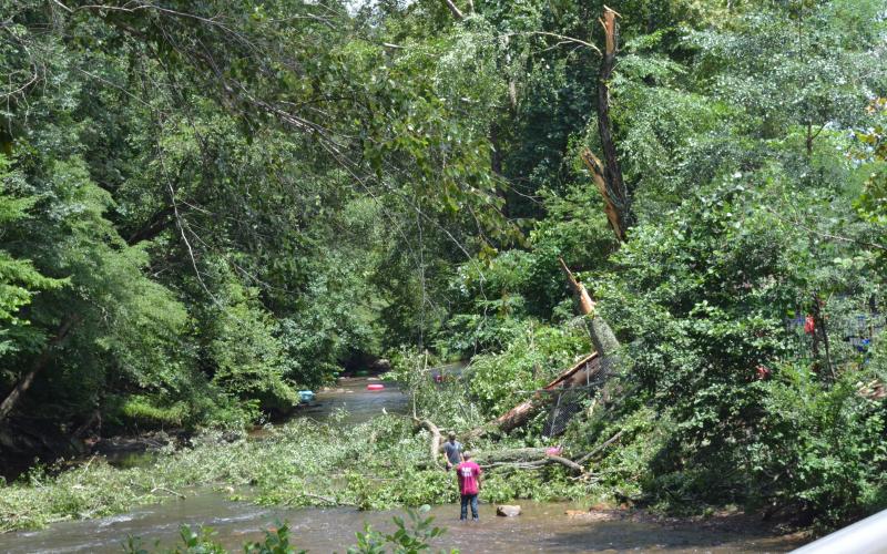 Workers were busy clearing the trees that fell into the river in Helen. (Photo/Stephanie Hill)