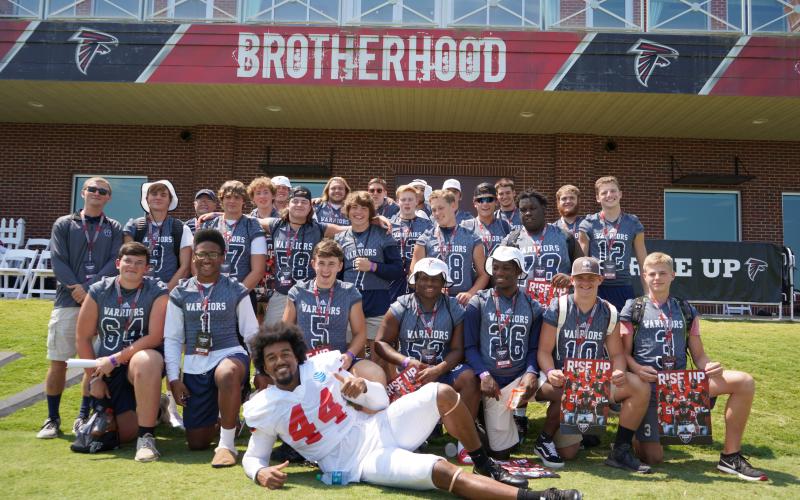 Members of the White County football team pose with Atlanta Falcons' linebacker Vic Beasley after practice last Saturday at the team's complex in Flowery Branch. 