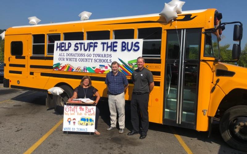 White County School System bus driver, Jack Haas, alongside the transportation department, organized a “Help Stuff the Bus” school supply drive. If you would like to donate, please stop by the bus in the Wal-Mart parking lot between now and Monday, Aug. 5. Pictured are superintendent Dr. Laurie Burkett, transportation director Darren Sledge, and assistant superintendent Scott Justus.