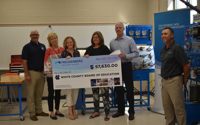 Shown from left are WCHS industrial mechanics teacher Tim Mayo, Assistant Principal Angie Helton, Principal Mary Anne Collier, White County Schools Superintendent Dr. Laurie Burkett, Gary VanWambeke (Freudenberg NOK vice president for Global Lead Center Transmission and Driveline Seals) and Wyman Hare, Cleveland plant manager for Freudenberg NOK. (Photo/Wayne Hardy)