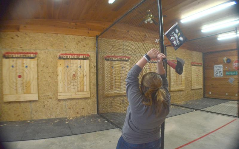 Jana Vaughan takes aim during a round of axe throwing at Highway to Hell’n near Cleveland. (Photo/Wayne Hardy)