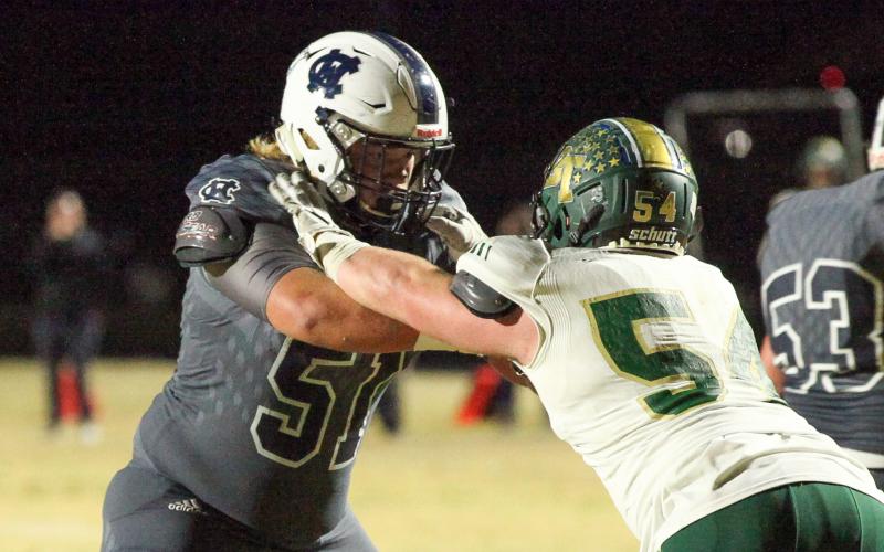 WCHS guard Jacob Anderson, left, locks up with Blessed Trinity defensive lineman Regan Smith during the season finale. (Photos/Staci Sulhoff)