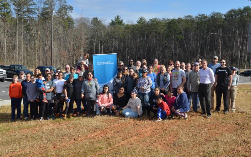 Some of the participants in Saturday’s tree planting are shown gathered for a group photo around lunch. (Photo/Wayne Hardy)