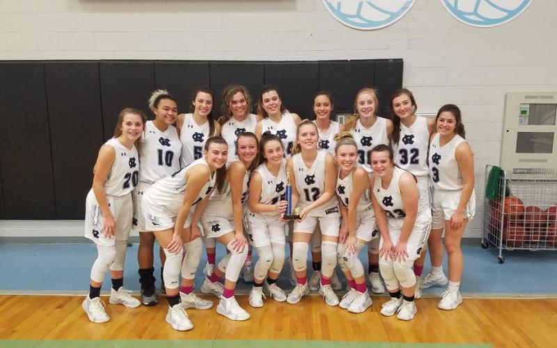 The Lady Warriors show off some Beach Bash hardware after posting a 3-0 record to win the Silver Bracket tournament at the Beach Bash last weekend in Panama City, Fla. (Photo/WCHS Lady Warriors Basketball)