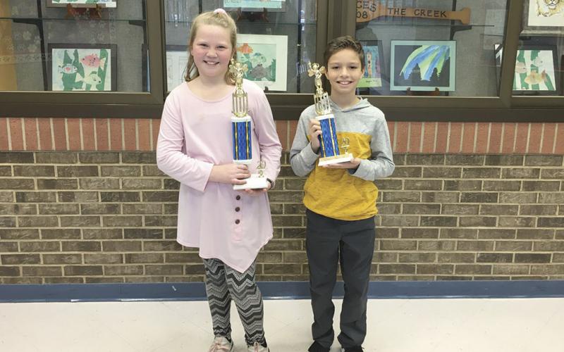 Fifth-grader Alli Daves, left, of Mossy Creek Elementary School, won the system-wide school Spelling Bee out of a field of 84 students. Brayden Gerrell, a fourth-grader also at MCES, was the runner-up. (Submitted photo)