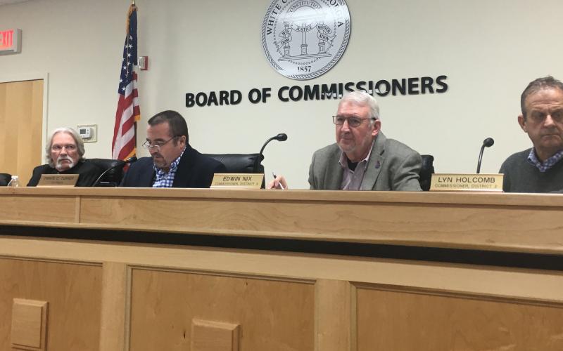 White County Board of Commissioners Chairman Travis Turner (middle) reads aloud the proclamation as fellow commissioners listen, from left Craig Bryant, Edwin Nix and Lyn Holcomb. (Photo/Wayne Hardy)