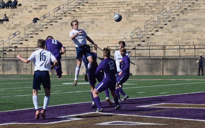 Andrew Pierce lands a header during the match with Lumpkin County. Pierce scored the winning goal in the second half. (Photo/Mark Turner)
