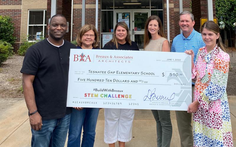 Pictured are Tesnatee Gap Elementary School  Principal Dr. Octavius Mulligan, White County School System  Superintendent Dr. Laurie Burkett, TGES Assistant Principal Diedre Alexander, Director of Student Acountability Jennifer King, Assistant Superintendent Scott Justus, and Marketing Director at Breaux & Associates  Besty Mellott, holding the check TGES received for coming in 5th place. (Submitted photo)