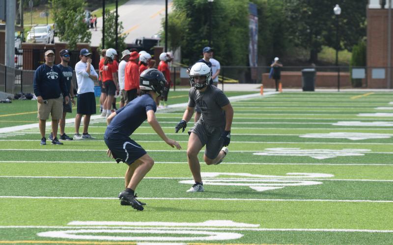 The Warriors, including senior receiver Cooper Turner, right, won't be able to compete in 7-on-7 events in June due to the COVID-19 pandemic. The team will open summer workouts next week at the high school complex. 