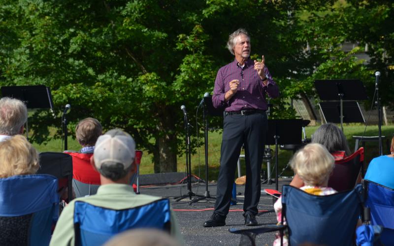Helen First Baptist Church Pastor Jim Holmes speaks to the congregation during an outdoor service Sunday, June 28, in which Holmes was thanked for 20 years of service at the church. (Photos/Wayne Hardy)
