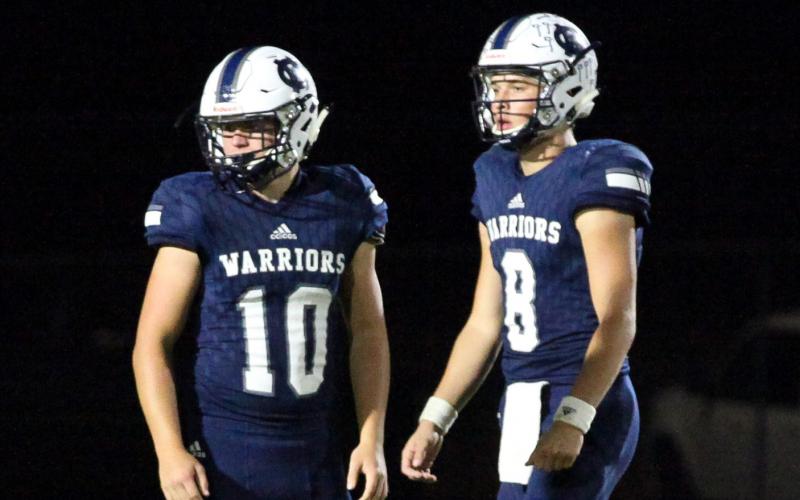 Riley Stancil, leftl, J. Ben Haynes, right, and the Warriors take on Stephens County Friday night in Cleveland in the season opener. (Photo/Mark Turner)