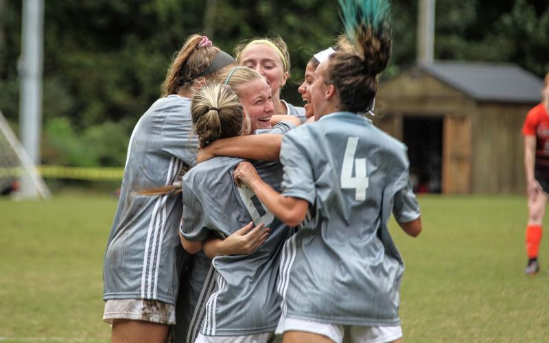 Truett McConnell's Sydney League, center, celebrates with her teammates after scoring the game-winning goal in a 1-0 victory over Union College.  (Photo/TMU Athletics)