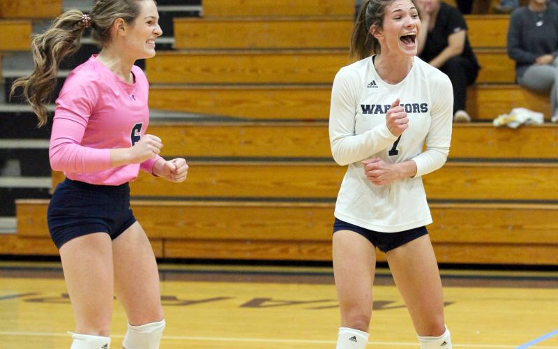 Macy Boggs, left, and Shelby Spain celebrate during the team's win over Habersham Central. (Photo/Staci Sulhoff)