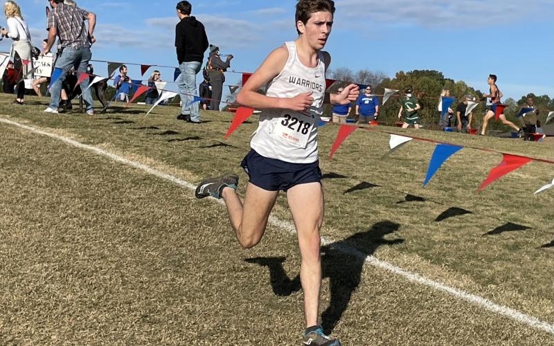 Eamonn O'Bryant turned in a time of 17:04.30 to finish seventh among 221 runnners in the AAA field. (Photos/WCHS Athletics)