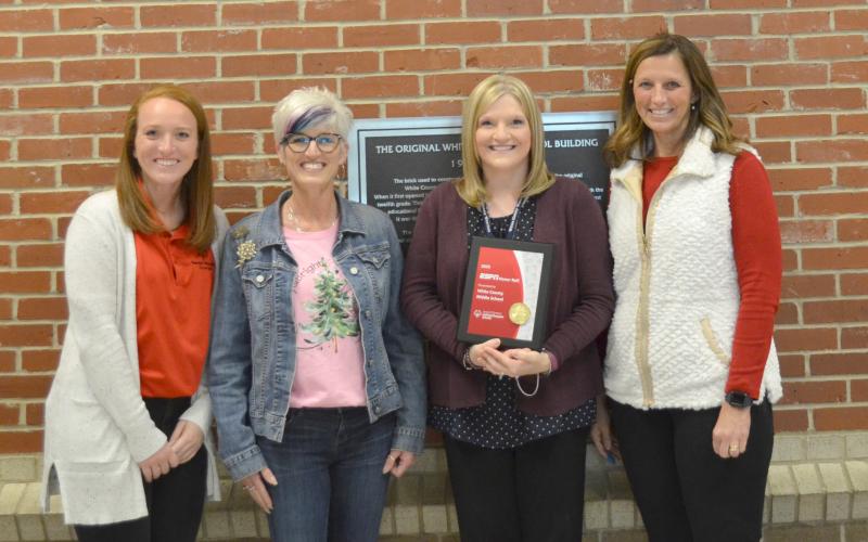 Pictured from left, are Kelli Bonner with Special Olympics Georgia, Sharon Brown with White County Special Olympics, Julie Collins and WCMS Principal Kristi Gerrells after the presentation on Thursday, Dec. 10. (Photo/Stephanie Hill)