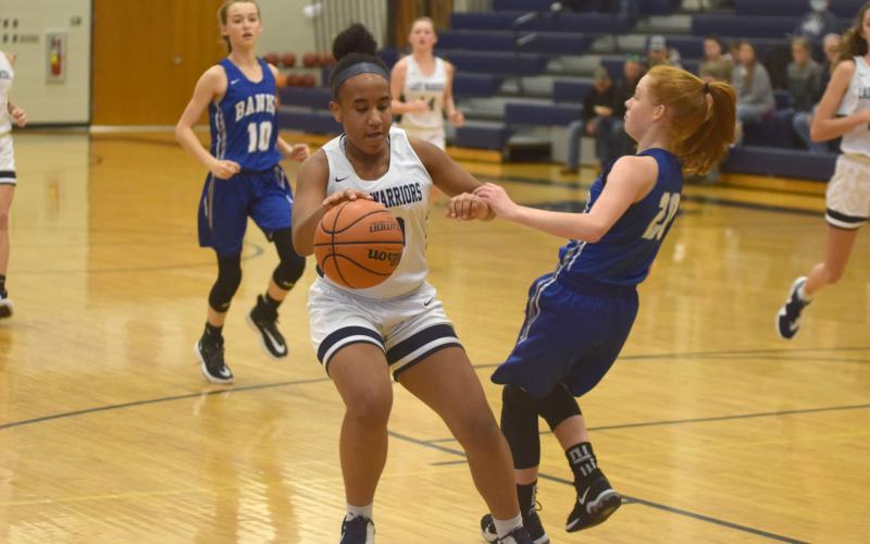 Kiannah Dorsey protects the ball during a recent eighth-grade girls game. (Photos/Mark Turner)