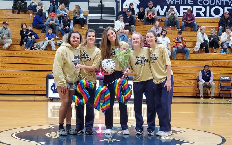 Senior Maddie Futch, with ball, was honored during a postgame ceremony after she recently passed the 500- rebound mark for her career. Futch was joined in the ceremony by her family and teammates, including fellow seniors, from left, Dasha Cannon, Makenna Moose, Madison Adams, and Camyrn McAfee. 