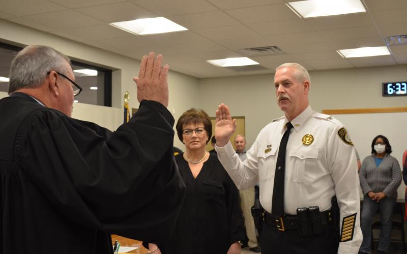 Cleveland Municipal Court Judge Garrison Baker swore in Jeff Shoemaker as the new Cleveland police chief on Monday, Feb. 8. Pictured with Shoemaker is his wife, Andrea Shoemaker. (Photo/Stephanie Hill)