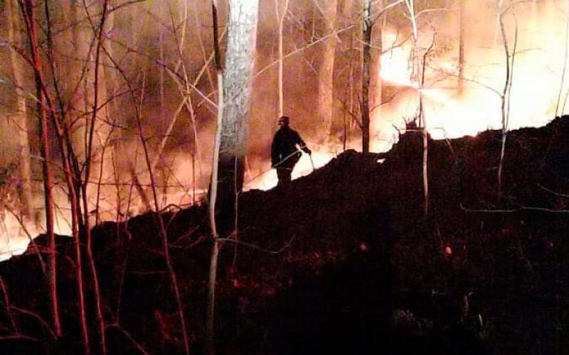 Firefighters worked hard on Sunday, March 7 to protect homes from a wildfire on Yonah Mountain. (Photos courtesy White County Public Safety)
