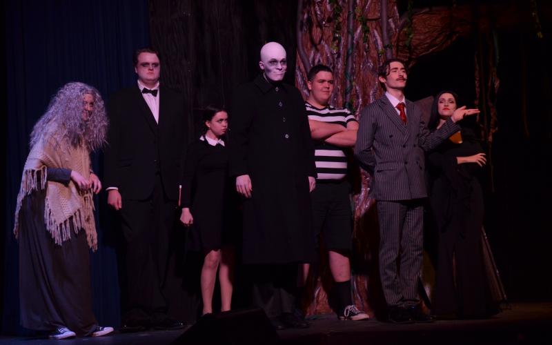 Pictured, from left to right, are Doni Martin as Grandma, Tim Behan as Lurch, Molly Cutchshaw as Wednesday Addams, Colin Baughman as Fester, Gabe Talafous as Pugsley, Ben Perrin as Gomez Addams, and Ireland Ballington as Morticia Addams, played their characters perfectly during dress rehearsal.