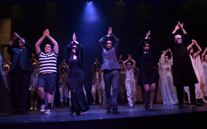 The cast of The Addams Family has a fun time dancing throughout the opening number of the show. 