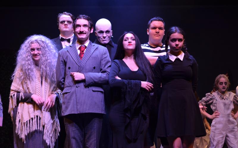 Pictured from left, are Doni Martin as Grandma, Tim Behan as Lurch, Ben Perrin as Gomez Addams, Colin Baughman as Fester, Ireland Ballington as Morticia Addams, Gabe Talafous as Pugsley, and Molly Cutchshaw as Wednesday Addams, during one of the final dress rehearsals before the show opens. (Photos/Stephanie Hill)