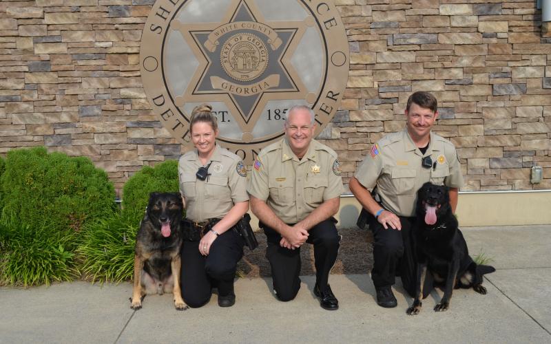 White County deputies Erin Thomas, with her K9 Henzo, and John Thomas, with his K9 Skuter, recently joined the White County Sheriff’s Office. The deputies and the K9s are pictured above with Sheriff Rick Kelly. (Photo/Stephanie Hill)