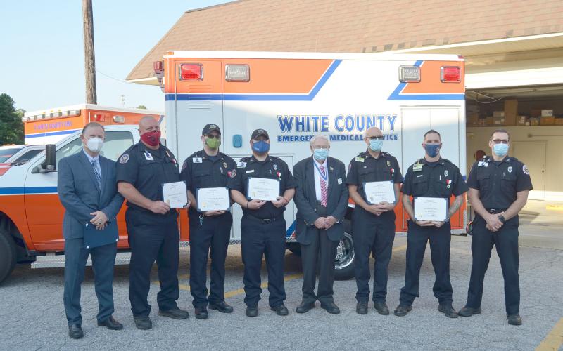 Shown from left are Northeast Georgia Medical Center Emergency Medical Transportation Director Scott Masters, paramedics Jason Meaders, Ben Dills and Andy Turk, Ron Hill, president of the Joseph Habersham Chapter – Sons of the American Revolution, paramedic Rondal Robinson, EMT Robert Rhodes and White County EMS Director Bill Scandrett. (Photo/Wayne Hardy)