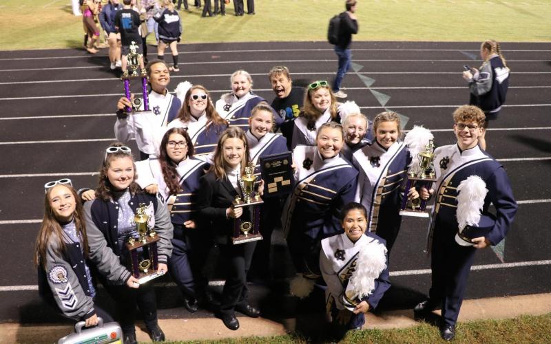 White County High School marching band members pose with some of the hardware won during their recent band competition. (Submitted photo)