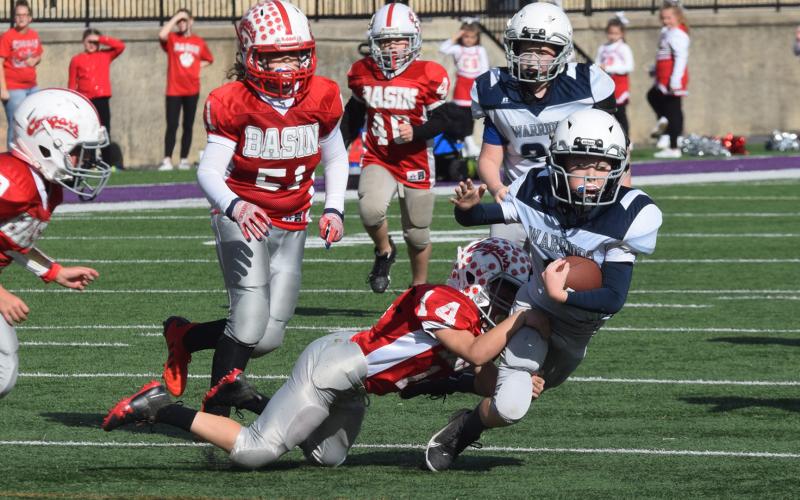 White County's John Jarrard is brought down by a Copper Basin defender during the Mountain Athletic Conference's fifth-grade semifinal game last weekend at Lumpkin County High School. (Photo/Mark Turner)