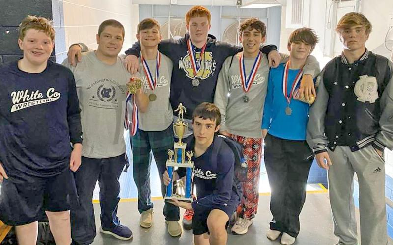 Members of the WCHS wrestling team show off some of the hardware the team won during the Granite City Scramble last weekend in Elberton. Shown are, front, Bryson Ravan; standing from left, Tyler Long, WCHS head coach Patrick Lowendick, Caden Autry, Gunner Young, Mason Autry, Aiden Pickett, and Ashton Pickett. (Photo/WCHS Wrestling)