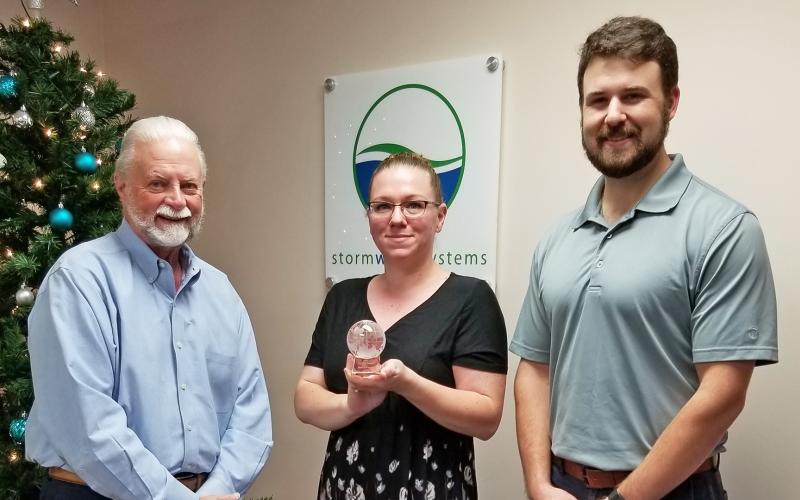 Shown from left are Storm Water Systems President Gary Hopkins, General Manager Liz Menius and Dustin Dunagan, business development. 
