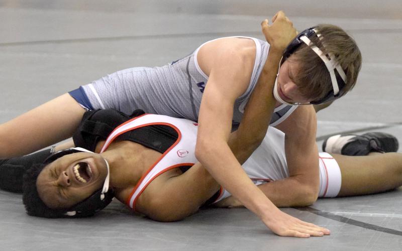 White County's Caden Autry pins Archer's MJ Maze during the Hook'Em Holiday Classic last week at Lambert High School. Autry won the 120-pound division title with a 4-0 record. (Photo/Mark Turner)