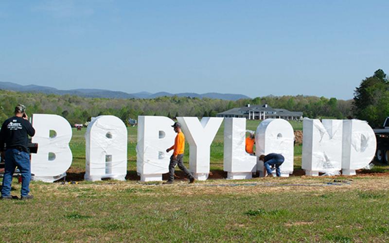 Workers from Owens Welding Inc. installing the letters along Appalachian Parkway. (Photos/ Ashley Blair)