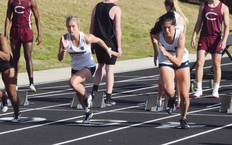 White County's Emma Hare, left, and Adelynn Knight take off at the start of the 100-meter race last week at Chestatee. Knight won the race, with Hare finishing second. (Photos/Mark Turner)