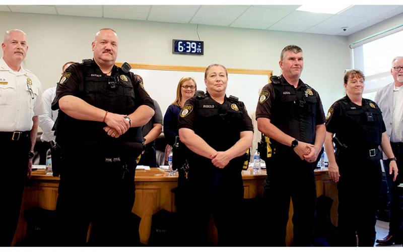 From left, Cleveland Police Chief Jeff Shoemaker, CPD Officers Rayner, Riebold, Addis, and Sims sporting bullet proof vests and President of North Georgia Mountains Lodge #112 Micheal Palmer at the city council meeting held on May 9. (Ashley Blair/WCN)