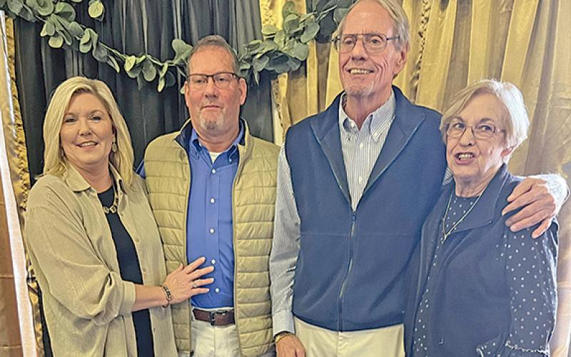 Jerry Elkins was honored at a retirement reception by the city of Helen. Darrell Westmoreland will replace him as city manager. From left are Deena Westmoreland, wife of Darrell Westmoreland, Darrell, Jerry Elkins and his wife Sandra. (Photo/Linda Erbele)