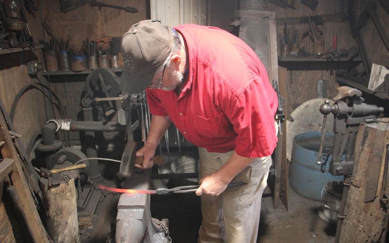 Greg Petitt works in his blacksmith shop behind his chiropractic office on Kytle Street. (Photo/Jessica Wood)