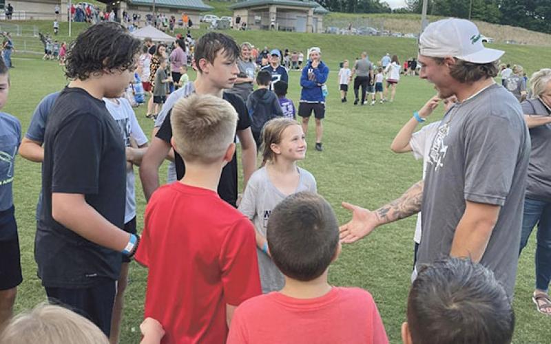 Tenneessee Titans' receiver Mason Kinsey, right, talks to a group of campers during the Brayden Philyaw Swift Feet & Agility Camp at the Tesnatee Gap Sports Complex. (Photo/Miranda Philyaw)