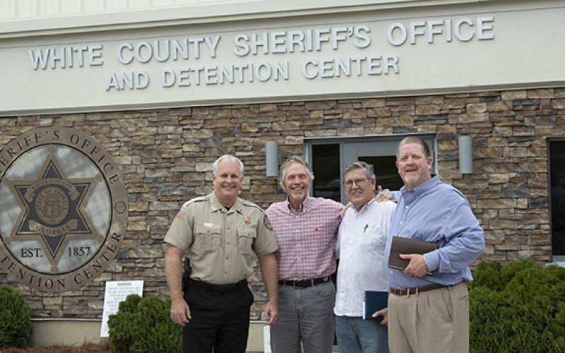 White County Sheriff Rick Kelley, Lead Pastor Jim Holmes, Chaplain Vic Bedzyk and Associate Pastor Steve Smith from Helen First Baptist in front of the White County Sheriff’s Office where the weekly jail ministry is held. (Photo/Noah Johnson)