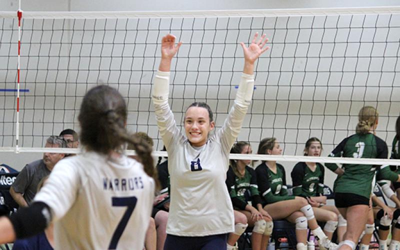 Kate Blair celebrates a point during the second set of the area win Tuesday over Wesleyan. (Photo/Mark Turner)