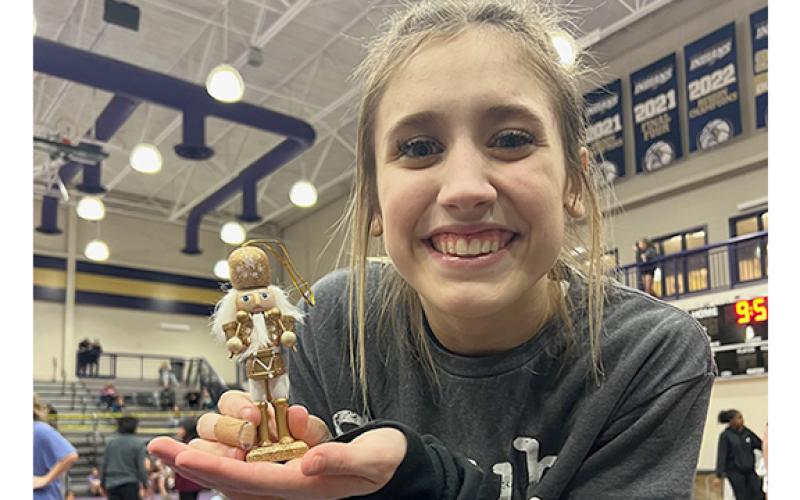 Ollie Weiland shows off the Nutcracker trophy after winning the 102.2-109.8 pound title in the girl's tournament. (Photo/WCHS Wrestling)