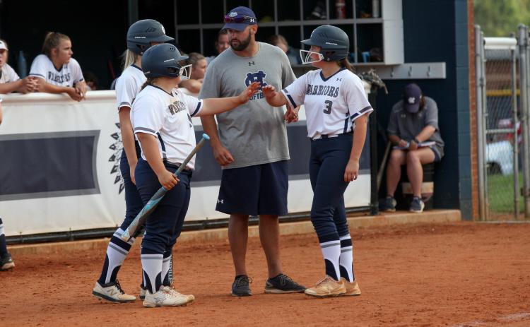 WCHS head coach Drew Owens, middle, and the Lady Warriors are looking to make another playoff run this fall. (Photo/Mark Turner)